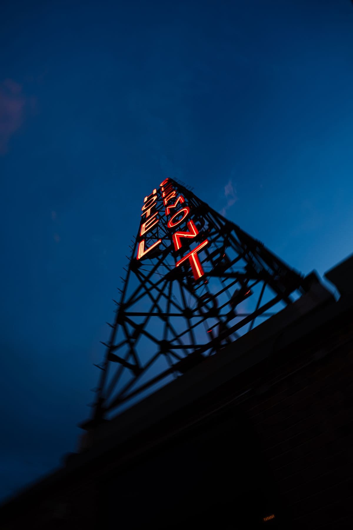 The Hotel Clermont sign lit up at blue hour